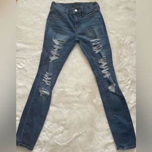 Dark washed ripped skinny jeans from the Kendall and Kylie collection, size 25US